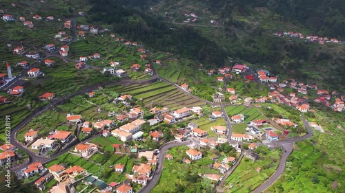 Discover stunning aerial views of Sao Vicente in Madeira, showcasing lush landscapes, charming houses, and natural beauty. Experience the serene environment and rich scenery.