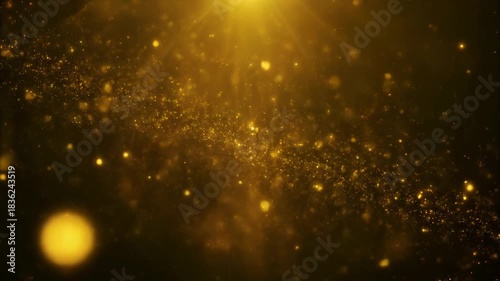 Luxurious golden dust particles background with bokeh and top spotlight effect