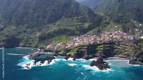 Experience breathtaking aerial views of Seixal, a picturesque village in Madeira. Discover its charming homes, lush landscapes, and stunning coastline. A perfect escape for nature lovers.
