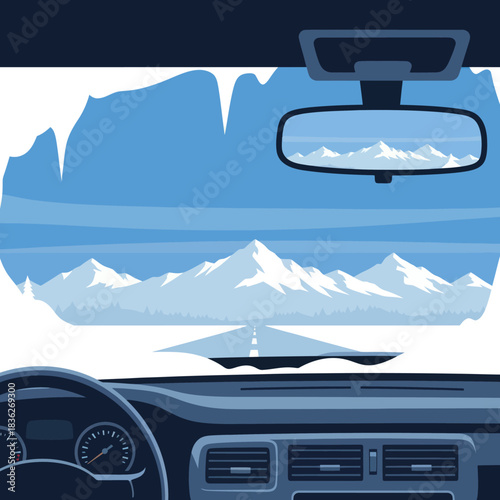Driving through snowy mountains, scenic view from car interior.