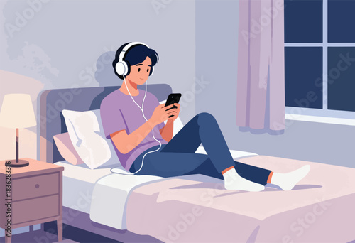 A person wearing headphones, lying on a bed, looks at their phone with a lamp and window nearby