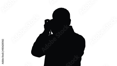Man silhouette taking picture with camera