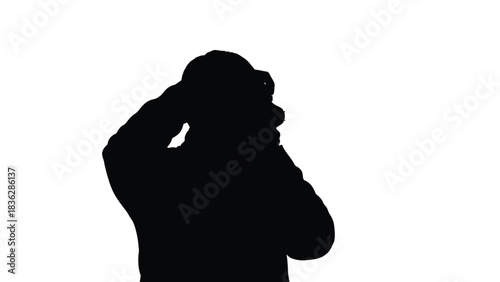 Man silhouette holding head in hands
