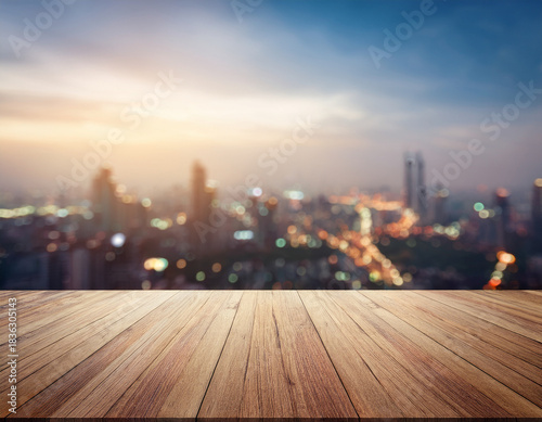 Blank wooden table top on blurred modern city mockup background,