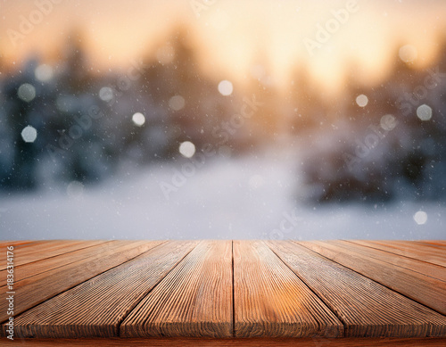 Vintage wooden table in front of a blurry winter holiday background