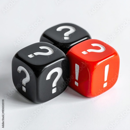 Three dice, two black and one red, each face displaying a question mark or exclamation point