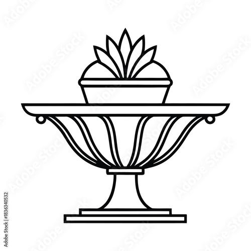 Antique stone vase holding a black and white flower decoration