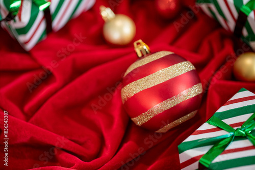 Merry Christmas. Happy Holidays greeting card,  banner. Christmas decoration  Red Christmas ornaments and gifts, presents on red background.  Xmas holiday festive theme.  