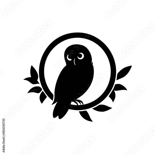 Silhouette of an owl perched on a branch within a circle, adorned with leaves, creating a simple and elegant design.