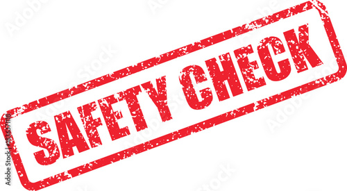 A red Safety Check rectangular rubber stamp with a distressed effect sits on a white backdrop
