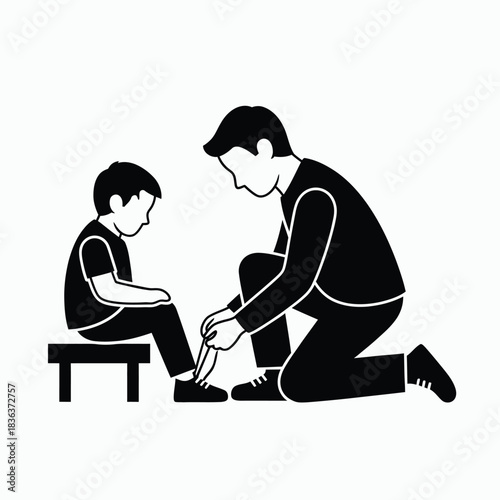 Father tying his son s shoelaces with care