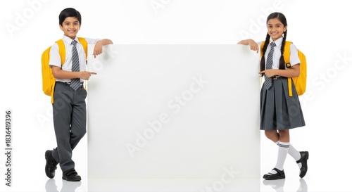 Happy Indian School Kids Pointing at Blank White Board