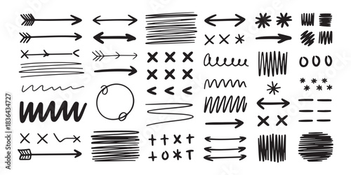Collection of hand drawn doodle arrows, lines, crosses, and other abstract shapes on a white background