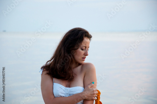 Silhouette girl sunrise. Romantic woman at sunset sea beach in summer. Woman sea sunrise. Sunset beach and sky with seascape. Summer sea beach sunrise. Girl at romantic sunset horizon. Twilight glow