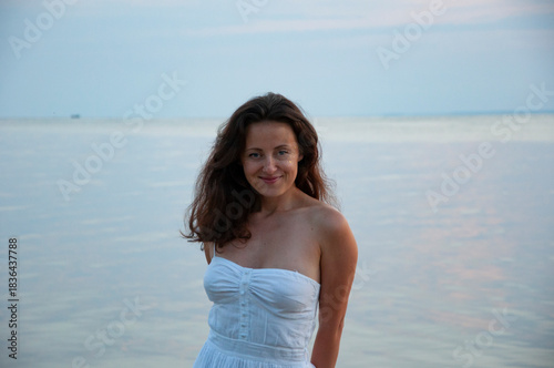 Summer sea beach sunrise. Girl portrait at romantic sunset horizon. Silhouette girl sunrise. Romantic woman at sunset sea beach in summer. Woman at sea sunrise. Sunset beach and sky with seascape