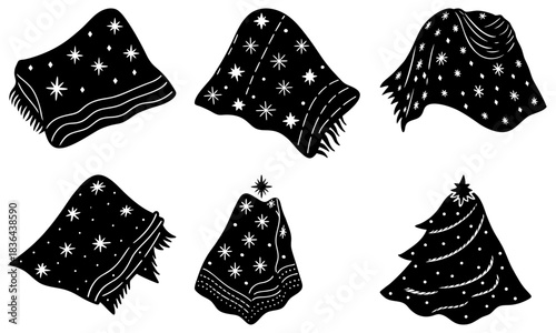 Six black and white stylized star patterned blankets and throws in various draped positions and shapes