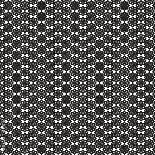 Intricate black and white geometric pattern with repeating floral motifs creates a mesmerizing optical illusion effect