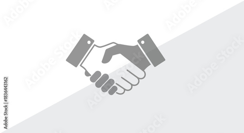 Simple gray icon of two hands firmly clasped in a business handshake