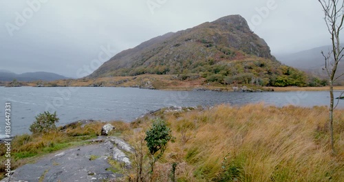 Explore the Kerry region in Ireland with views of mountains, water, and nature on a rainy day