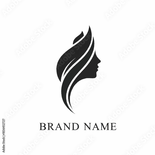 Elegant silhouette logo of a womans face with leaf design.