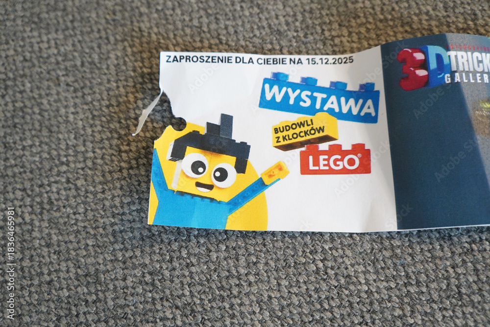 Obraz premium Lego exhibition invitation with a cartoon character on a gray carpet background