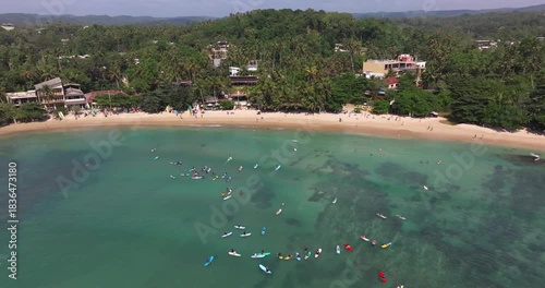 Aerial View of Hiriketiya Bay with surfers, Sri Lanka