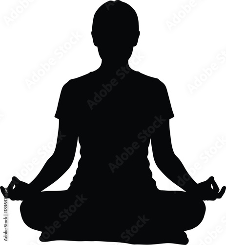 Silhouette of a person meditating in lotus position for concept of yoga and inner peace