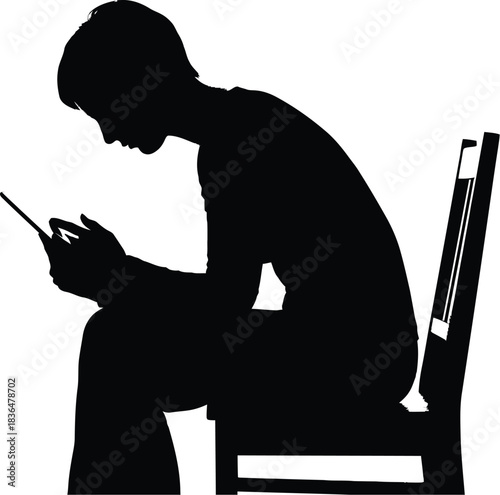 Silhouette of a person sitting a chair looking down at a smartphone