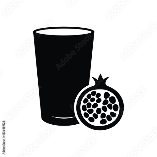 Black silhouette of a tall glass next to a halved pomegranate on white background fruit drink