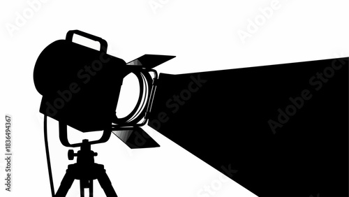 Black silhouette of a professional theater spotlight on a stand.