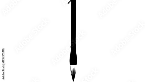 Single black paintbrush isolated on white background with sharp studio lighting