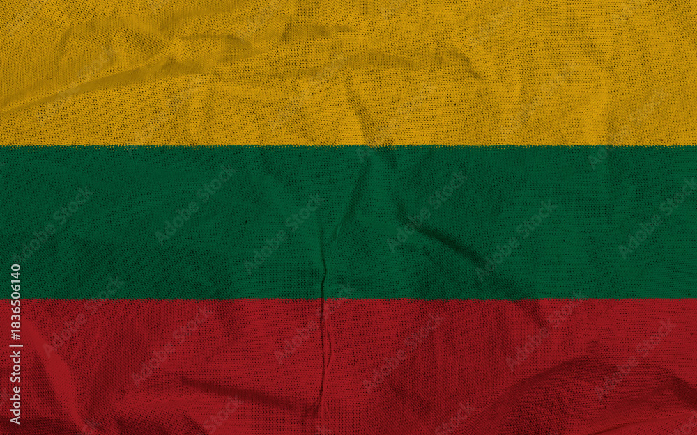 Fototapeta premium Lithuania National Flag With Yellow, Green, And Red Stripes On Textile Surface
