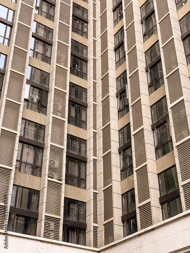 a close up photo of windows and facade of a business apartment in luohu shenzhen china