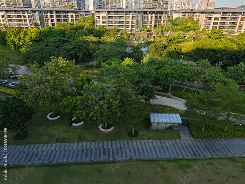 luxury villas and public greenland park with a pedestrian walk, photo taken in Shekou Shenzhen China