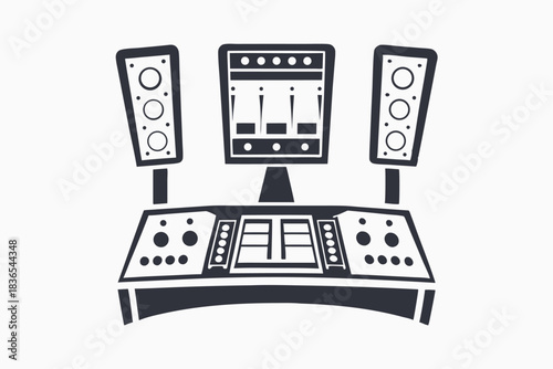 Isolated sound studio console shows an array of controls, speakers and monitor equipment