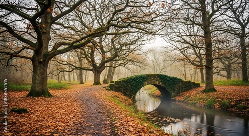 Autumn landscape with stone bridge in misty forest