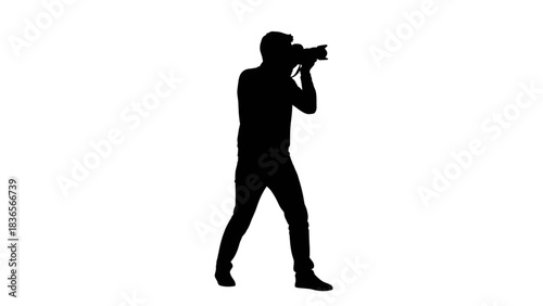Silhouette of a person holding a professional camera ready to capture stunning low light photography moments