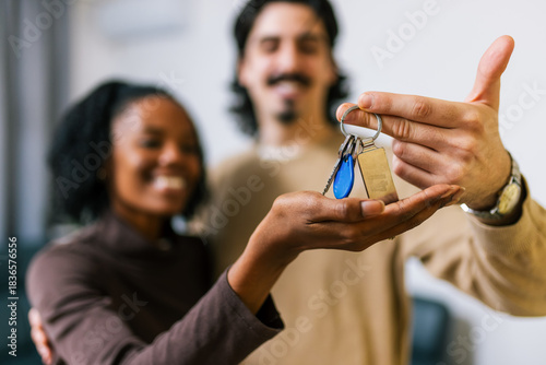Happy couple holding new home keys