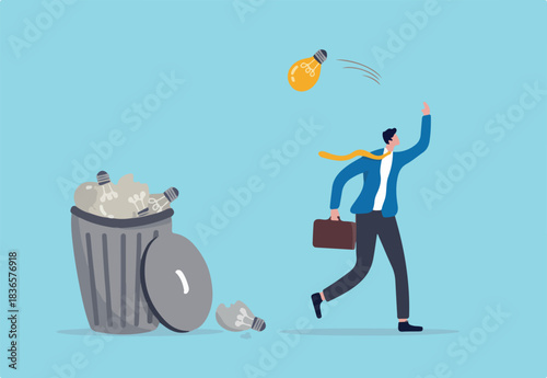 Wasted unworkable ideas, business failure or too many abandoned projects concept, frustrated businessman throw away lightbulb idea into full of junk idea in basket bin