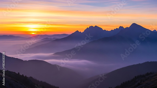 Majestic mountain peaks bathed in golden sunrise light