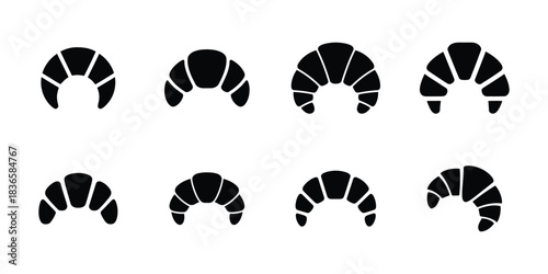 Eight black croissant icons on white background