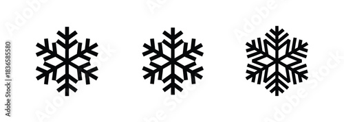 Three black and white geometric tribal patterns resembling stylized snowflakes or diamonds