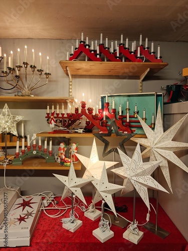 Christmas and New Year decorations in a thrift store, candles, stars, festive ornaments, second-hand holiday decor