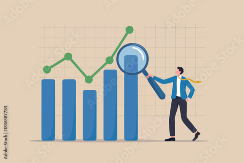 Man analyzing financial graph with magnifying glass and bar chart