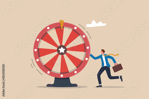 Businessman spinning a prize wheel for chance and opportunity concept