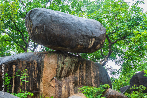Balancing Rock near Madan Mahal Fort in Jabalpur is a geological wonder that defies the laws of gravity. This natural formation consists of two large rocks balanced precariously on top of each other.