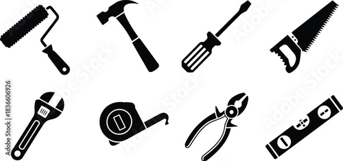 Set of black silhouette icons of hand tools including hammer, wrench, saw, and screwdriver, isolated on white for design use