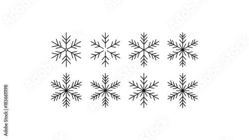 Collection of eight intricately detailed black snowflakes arranged in two rows against a clean white background for winter holiday design