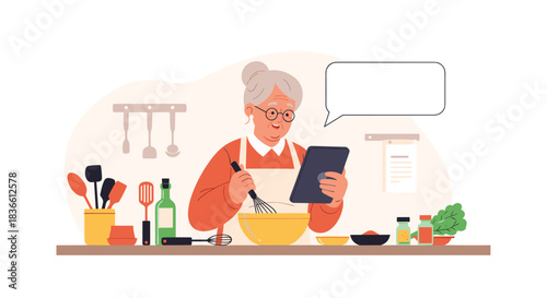 Happy senior woman with glasses uses a tablet for a recipe while she whisks in a bowl in her kitchen. This shows an older person enjoying cooking and modern technology with a speech bubble for text.