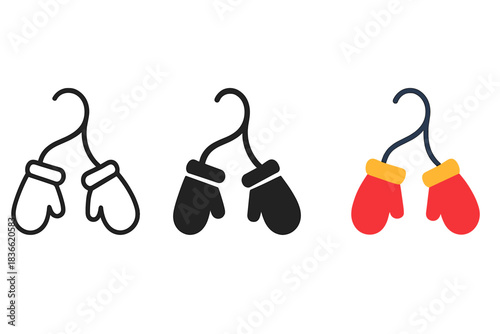 Three different colored gloves hanging on a clothesline